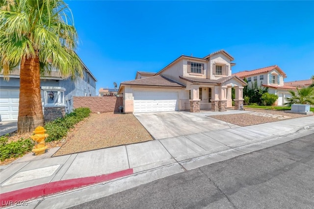 208 Glendon St, Henderson, NV 89074 - view of front of property featuring stucco siding, driveway, stone siding, and a garage