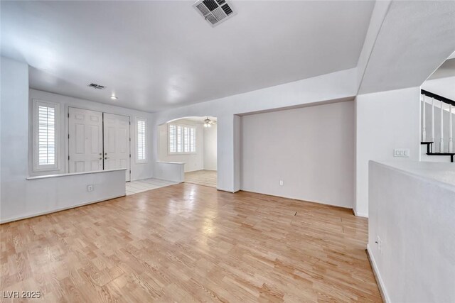 208 Glendon St, Henderson, NV 89074 - unfurnished living room featuring light wood-type flooring and arched walkways