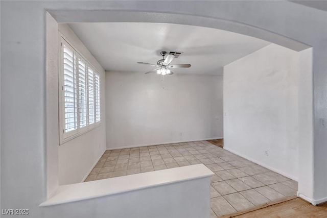208 Glendon St, Henderson, NV 89074 - empty room featuring ceiling fan, arched walkways, and tile patterned flooring