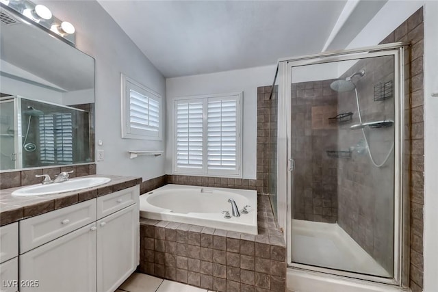 208 Glendon St, Henderson, NV 89074 - full bath featuring vanity, a bath, a stall shower, and tile patterned flooring