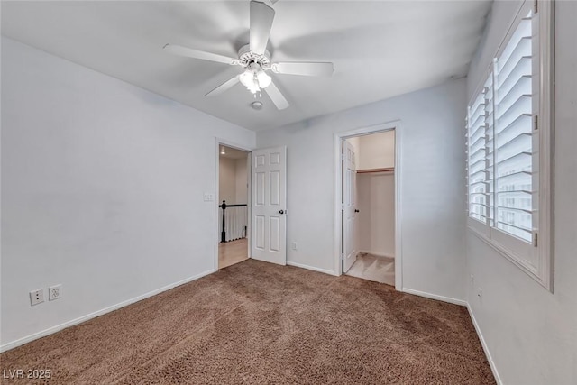 208 Glendon St, Henderson, NV 89074 - unfurnished bedroom with carpet, ceiling fan, and a walk in closet