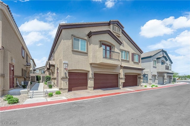 4650 Blaise Ave Unit 102, North Las Vegas, NV 89084 - mediterranean / spanish house with a residential view, a garage, and stucco siding