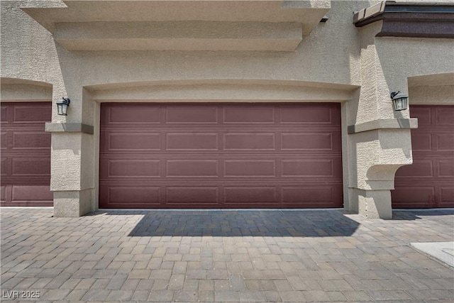 4650 Blaise Ave Unit 102, North Las Vegas, NV 89084 - garage featuring decorative driveway