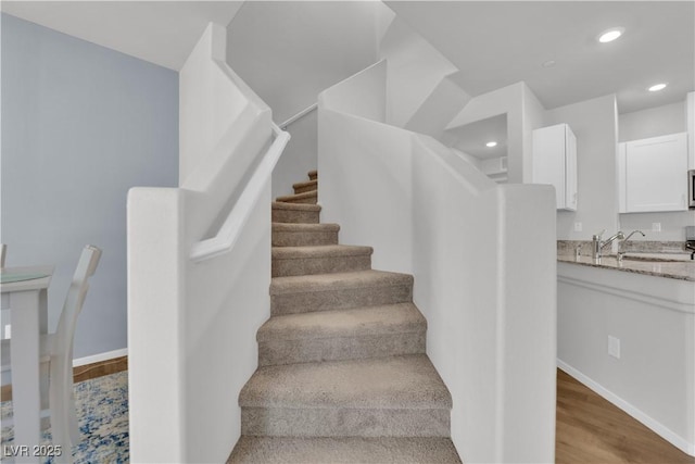 4650 Blaise Ave Unit 102, North Las Vegas, NV 89084 - stairs featuring wood finished floors and recessed lighting