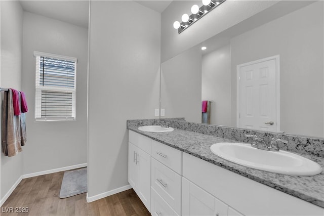 4650 Blaise Ave Unit 102, North Las Vegas, NV 89084 - bathroom with double vanity and wood finished floors