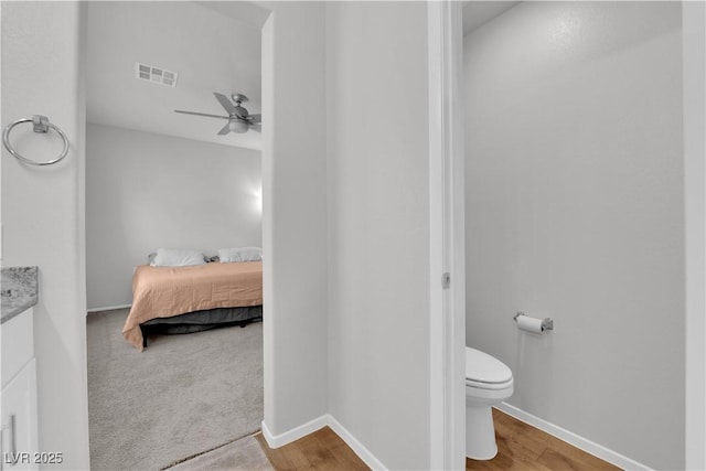 4650 Blaise Ave Unit 102, North Las Vegas, NV 89084 - ensuite bathroom featuring ceiling fan, vanity, and wood finished floors