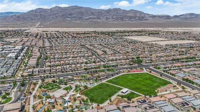 4650 Blaise Ave Unit 102, North Las Vegas, NV 89084 - aerial view of property's location featuring a mountain backdrop and nearby suburban area
