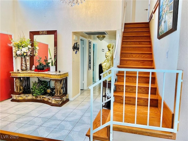 421 Courtney Ln, Las Vegas, NV 89107 - stairs with a high ceiling and tile patterned floors