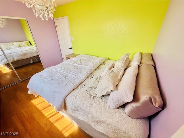 421 Courtney Ln, Las Vegas, NV 89107 - bedroom with wood finished floors and a chandelier