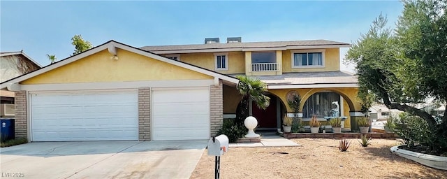 421 Courtney Ln, Las Vegas, NV 89107 - traditional-style house featuring a porch, stucco siding, concrete driveway, an attached garage, and brick siding