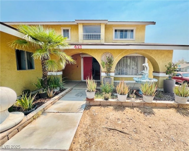 421 Courtney Ln, Las Vegas, NV 89107 - view of front of property with stucco siding and a balcony
