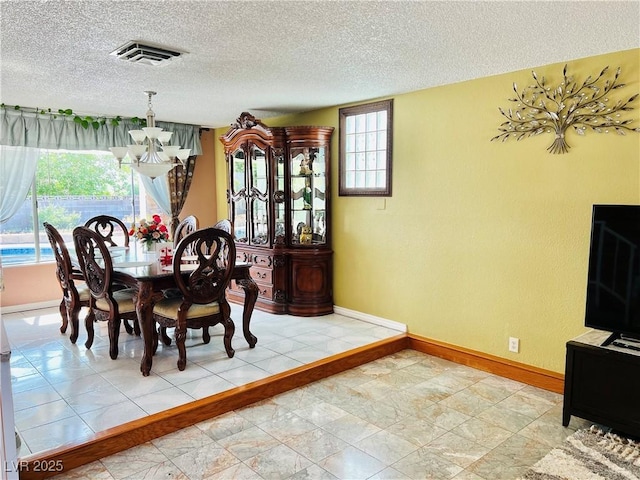 421 Courtney Ln, Las Vegas, NV 89107 - dining area with a chandelier and a textured ceiling