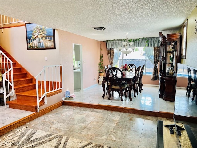 421 Courtney Ln, Las Vegas, NV 89107 - dining room with stairs, a chandelier, and a textured ceiling