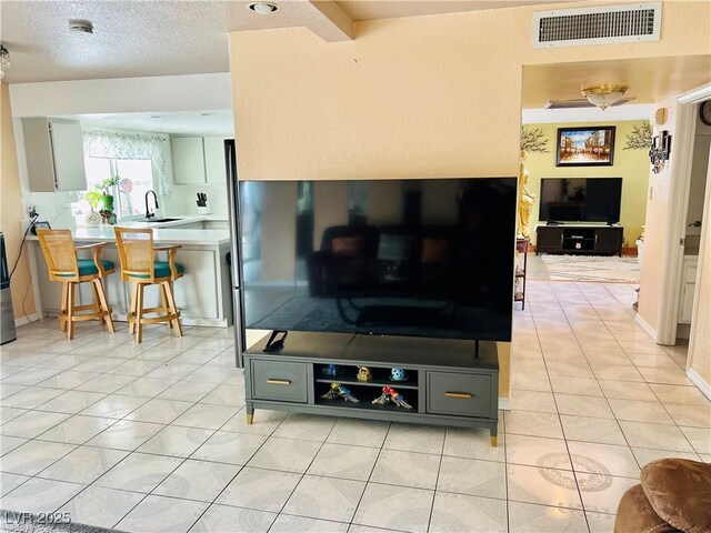 421 Courtney Ln, Las Vegas, NV 89107 - living area with light tile patterned floors and a textured ceiling