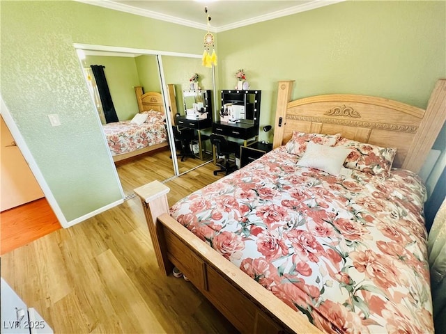 421 Courtney Ln, Las Vegas, NV 89107 - bedroom with wood finished floors, ornamental molding, and a closet