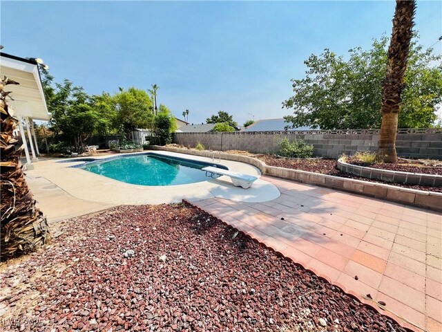 421 Courtney Ln, Las Vegas, NV 89107 - view of pool with a diving board, a fenced backyard, and a patio