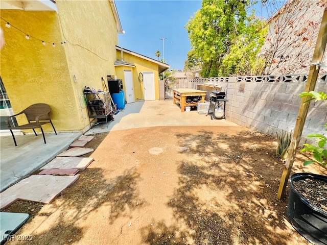 421 Courtney Ln, Las Vegas, NV 89107 - fenced backyard with a patio area and grilling area