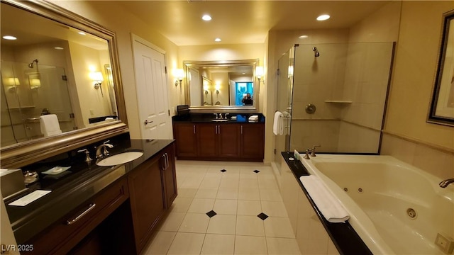 125 E Harmon Ave Unit 220, Las Vegas, NV 89109 - bathroom featuring a shower stall, tile patterned flooring, a tub with jets, vanity, and recessed lighting