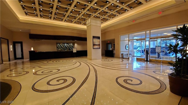 125 E Harmon Ave Unit 220, Las Vegas, NV 89109 - building lobby featuring coffered ceiling and a towering ceiling