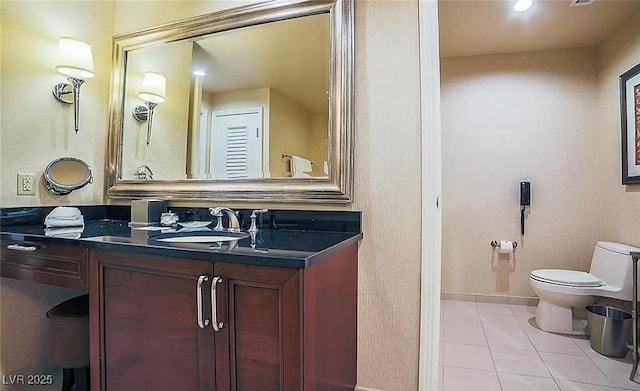 125 E Harmon Ave Unit 220, Las Vegas, NV 89109 - bathroom featuring tile patterned floors and vanity