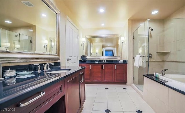 125 E Harmon Ave Unit 220, Las Vegas, NV 89109 - full bath with tile patterned floors, a stall shower, vanity, a bath, and recessed lighting