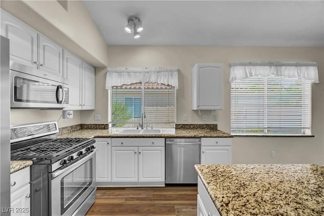 3520 Round Valley Way, Las Vegas, NV 89129 - kitchen featuring stainless steel appliances, stone counters, white cabinets, and dark wood-type flooring