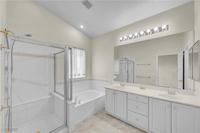 3520 Round Valley Way, Las Vegas, NV 89129 - bathroom with a bath, double vanity, a shower stall, tile patterned floors, and lofted ceiling