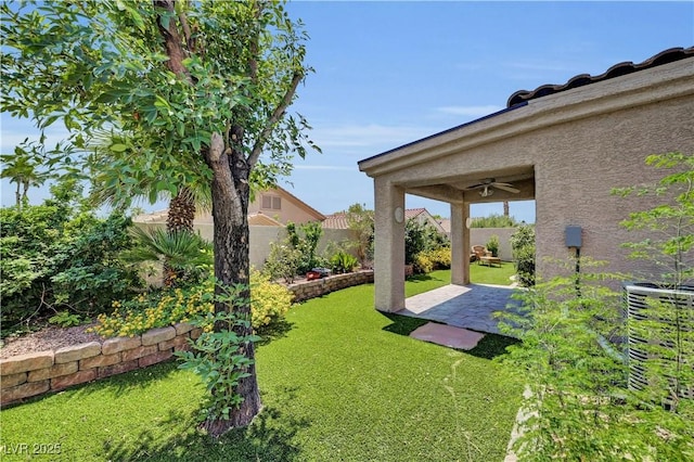 3520 Round Valley Way, Las Vegas, NV 89129 - fenced backyard with a ceiling fan and a patio area