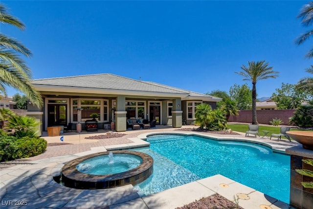 8465 Picket Ridge Ct, Las Vegas, NV 89143 - view of swimming pool featuring a patio area and a pool with connected hot tub