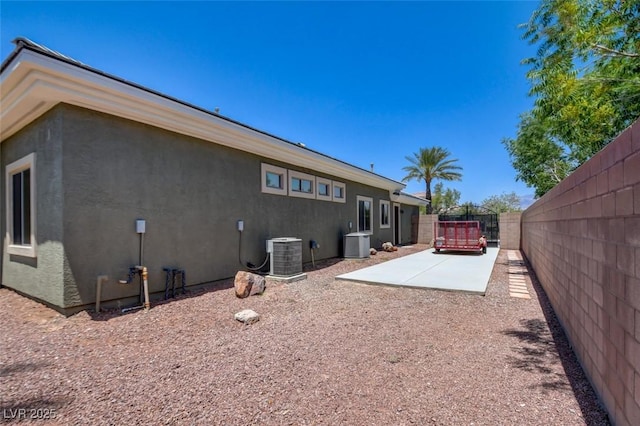 8465 Picket Ridge Ct, Las Vegas, NV 89143 - back of house featuring stucco siding and a patio area