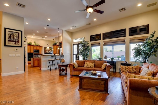 8465 Picket Ridge Ct, Las Vegas, NV 89143 - living area with light wood finished floors, ceiling fan, and recessed lighting