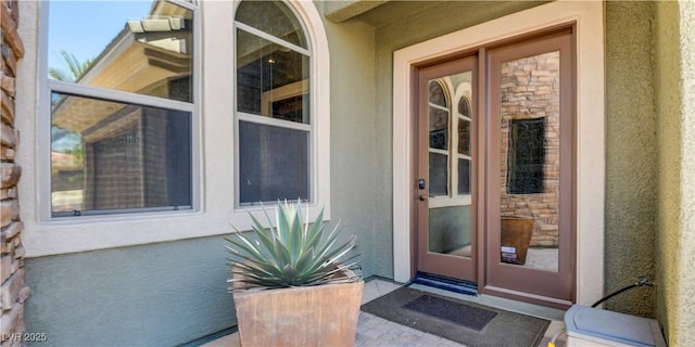 8465 Picket Ridge Ct, Las Vegas, NV 89143 - property entrance with stucco siding and stone siding