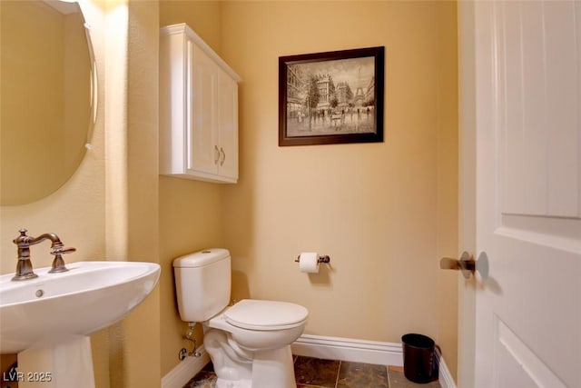8465 Picket Ridge Ct, Las Vegas, NV 89143 - half bath featuring baseboards and toilet
