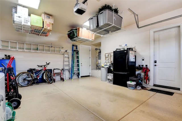 8465 Picket Ridge Ct, Las Vegas, NV 89143 - garage with a garage door opener and freestanding refrigerator