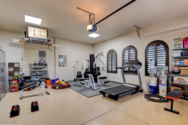8465 Picket Ridge Ct, Las Vegas, NV 89143 - workout room with a garage and plenty of natural light