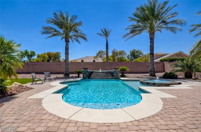 8465 Picket Ridge Ct, Las Vegas, NV 89143 - view of pool with a fenced backyard, a pool with connected hot tub, and a patio area