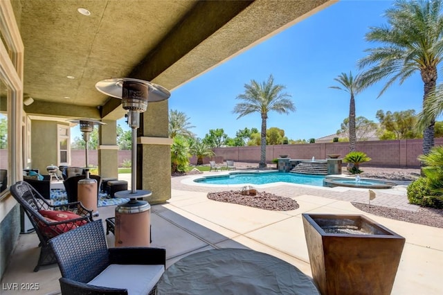 8465 Picket Ridge Ct, Las Vegas, NV 89143 - fenced backyard featuring a patio and a pool with connected hot tub