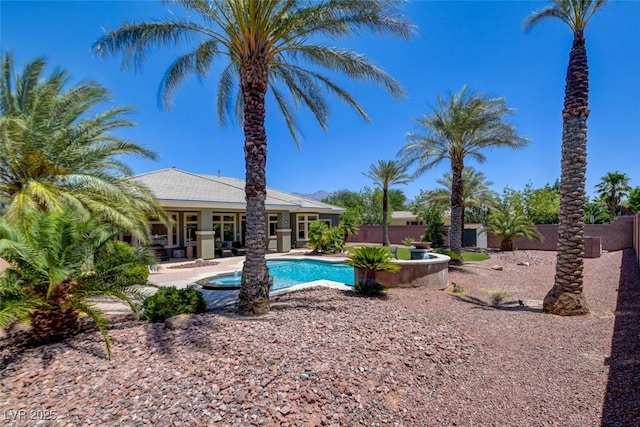 8465 Picket Ridge Ct, Las Vegas, NV 89143 - view of swimming pool featuring a patio, a fenced backyard, and a jacuzzi