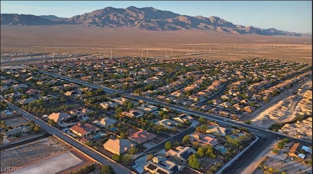 8465 Picket Ridge Ct, Las Vegas, NV 89143 - aerial overview of property's location featuring a mountain backdrop and nearby suburban area