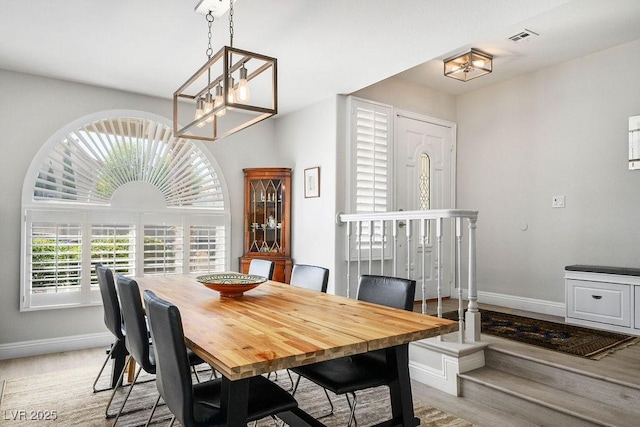 2228 Brighton Shore St, Las Vegas, NV 89128 - dining room featuring a chandelier and light wood-type flooring