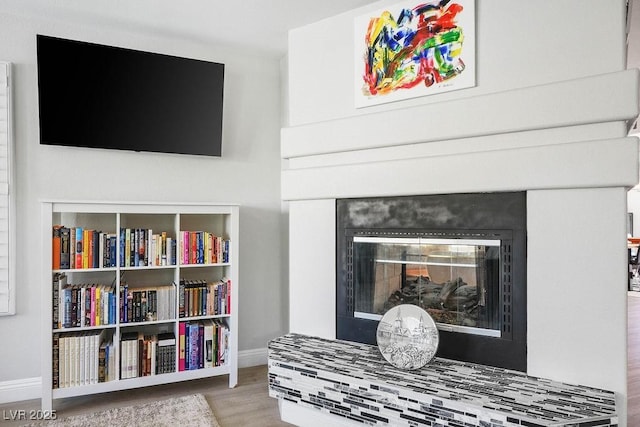 2228 Brighton Shore St, Las Vegas, NV 89128 - detailed view of wood finished floors and a glass covered fireplace
