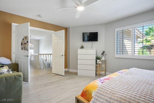 2228 Brighton Shore St, Las Vegas, NV 89128 - bedroom with light wood finished floors, multiple windows, and a ceiling fan