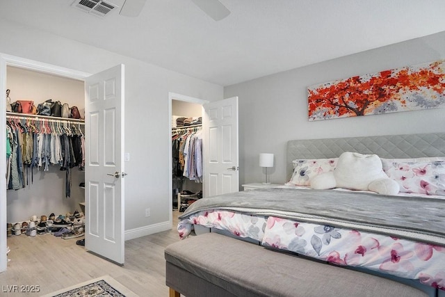 2228 Brighton Shore St, Las Vegas, NV 89128 - bedroom with a walk in closet, light wood-style floors, and ceiling fan