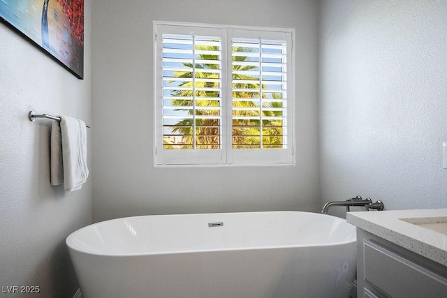 2228 Brighton Shore St, Las Vegas, NV 89128 - full bath with healthy amount of natural light, a freestanding bath, and vanity