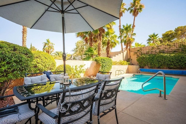 2228 Brighton Shore St, Las Vegas, NV 89128 - view of swimming pool with outdoor dining area, a fenced backyard, and a patio