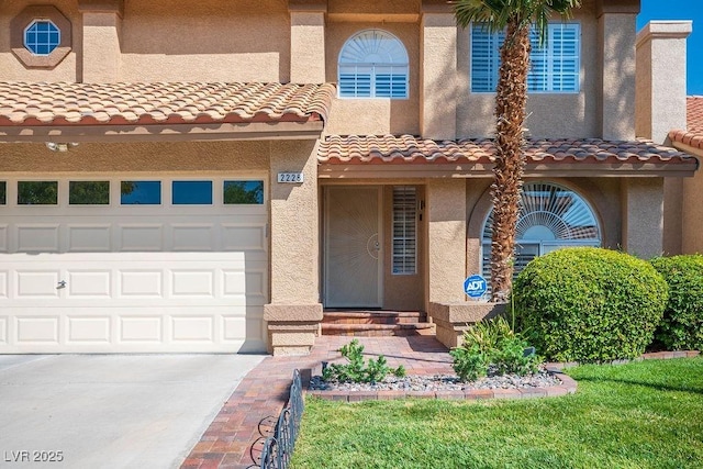 2228 Brighton Shore St, Las Vegas, NV 89128 - mediterranean / spanish-style home with stucco siding, driveway, and a tiled roof