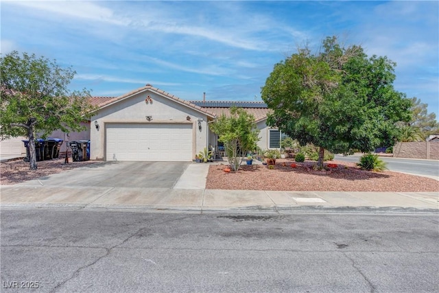441 Groft Way, Henderson, NV 89015 - view of front facade with driveway, a tile roof, an attached garage, and stucco siding