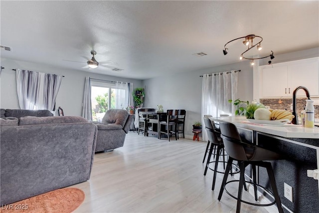 441 Groft Way, Henderson, NV 89015 - living area featuring light wood-type flooring and a ceiling fan