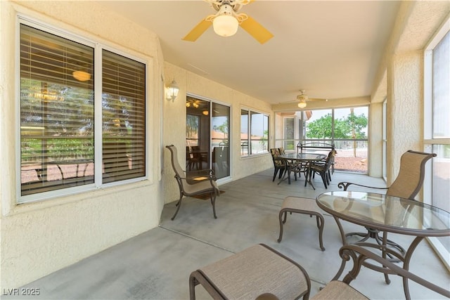 3016 Lotus Hill Dr, Las Vegas, NV 89134 - sunroom / solarium with a ceiling fan, outdoor dining area, concrete flooring, a textured wall, and lofted ceiling