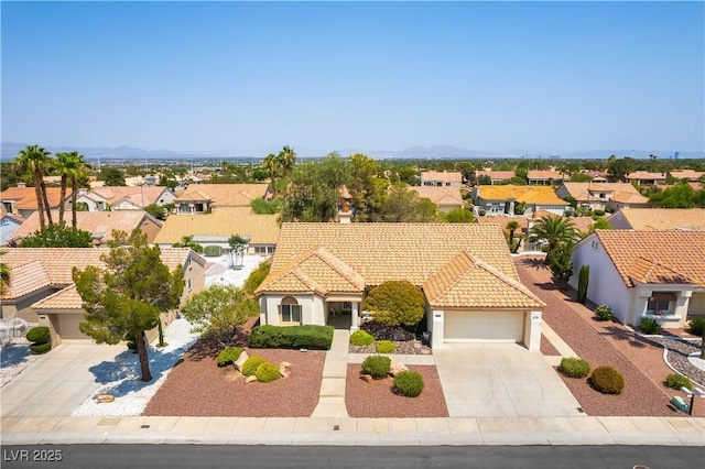 3016 Lotus Hill Dr, Las Vegas, NV 89134 - view of front facade with concrete driveway, a residential view, stucco siding, a garage, and a tile roof